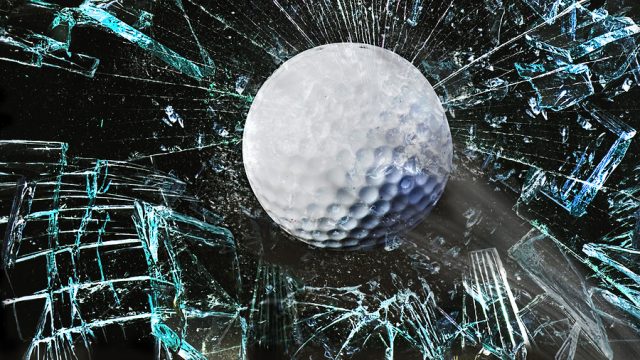 Fast golf ball through a broken window.